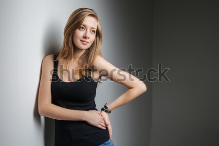 Stock photo: Beautiful young sexy woman wearing jeans shorts