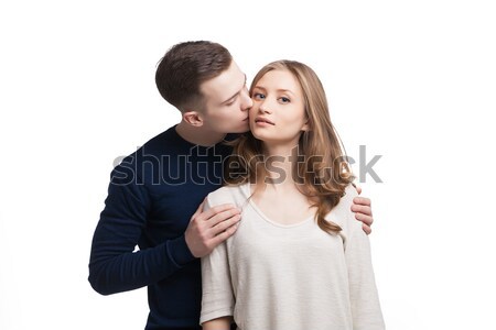 Portrait of woman being kissed by her boyfriend Stock photo © julenochek