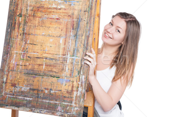 Jungen lächelnde Frau versteckt hinter Staffelei Maler Stock foto © julenochek