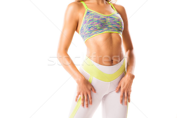 Crop sportive female posing on white background Stock photo © julenochek