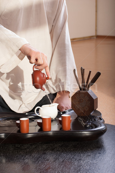 Young man holds a Chinese tea ceremony Stock photo © julenochek