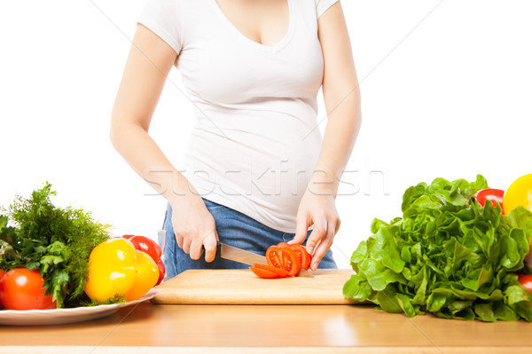 Unrecognizable woman cutting tomato Stock photo © julenochek