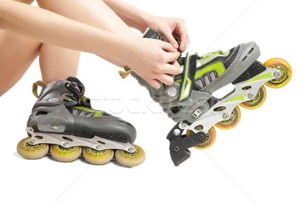 Woman lacing up rollers  Stock photo © julenochek