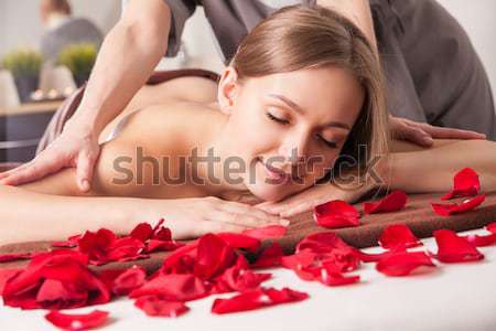 Woman enjoying Ayurveda oil massage in spa Stock photo © julenochek