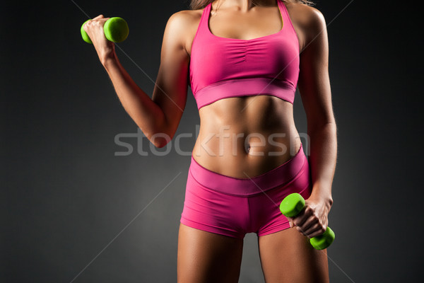 Crop sportive female working out Stock photo © julenochek