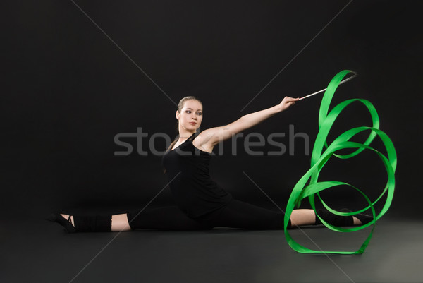 beautiful gymnast with green ribbon Stock photo © julenochek