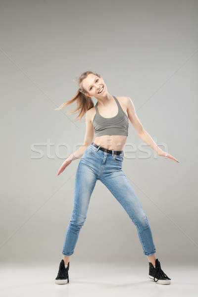 Portrait of happy young woman dancing Stock photo © julenochek
