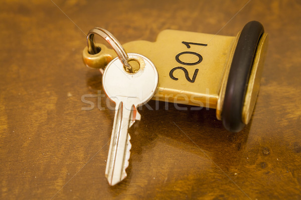 Hotel Room Key lying on Bed with keyring Stock photo © juniart