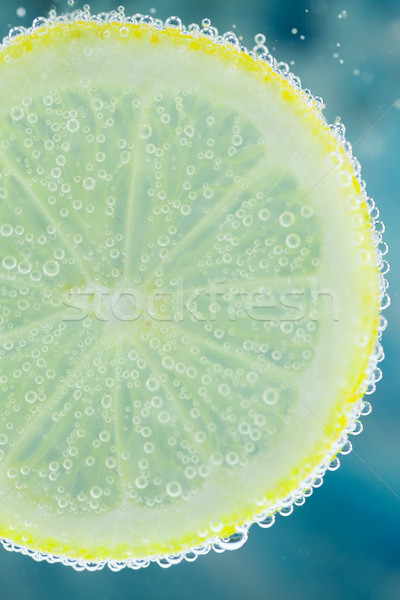 Lemon in carbonated water Stock photo © juniart