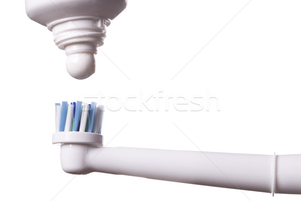 Electric periuţă de dinţi alb albastru tub Imagine de stoc © juniart