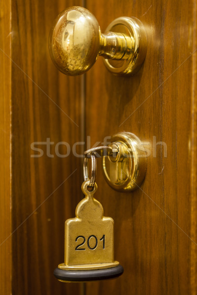 Hotel Room Key lying on Bed with keyring Stock photo © juniart