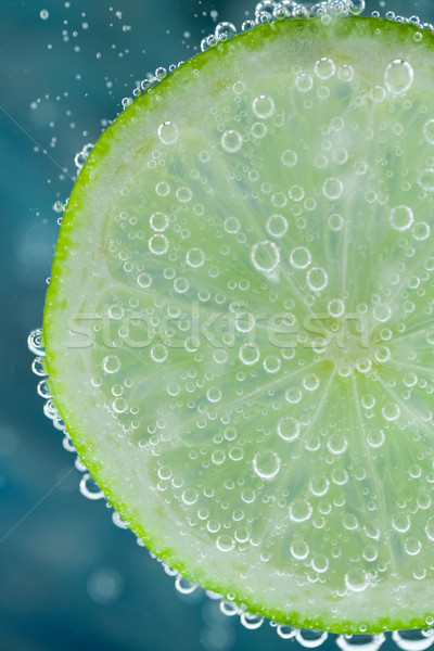 Citrus közelkép zöld szelet kék búvárkodik Stock fotó © juniart