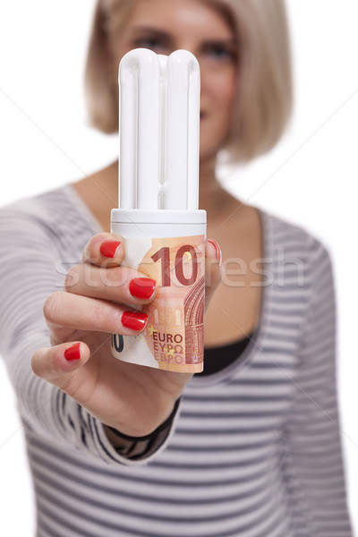 Woman holding an eco-friendly light bulb Stock photo © juniart