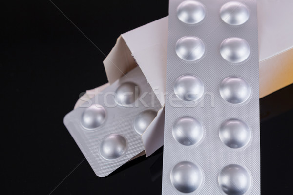 Silver blister pack of small pills Stock photo © juniart