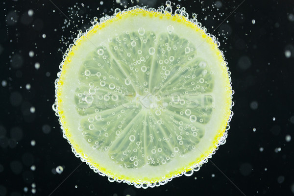 Zitronenscheibe Tauchen Wasser Ansicht Stock foto © juniart