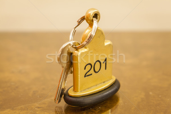 Hotel Room Key lying on Bed with keyring Stock photo © juniart