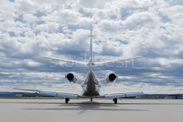 Aircraft learjet Plane in front of the Airport with cloudy sky Stock photo © juniart