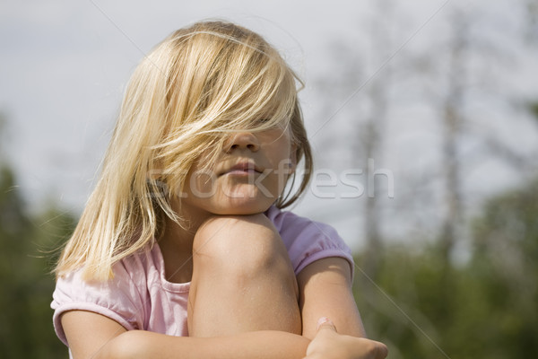 Grumpy looking young girl outdoors Stock photo © Kajura