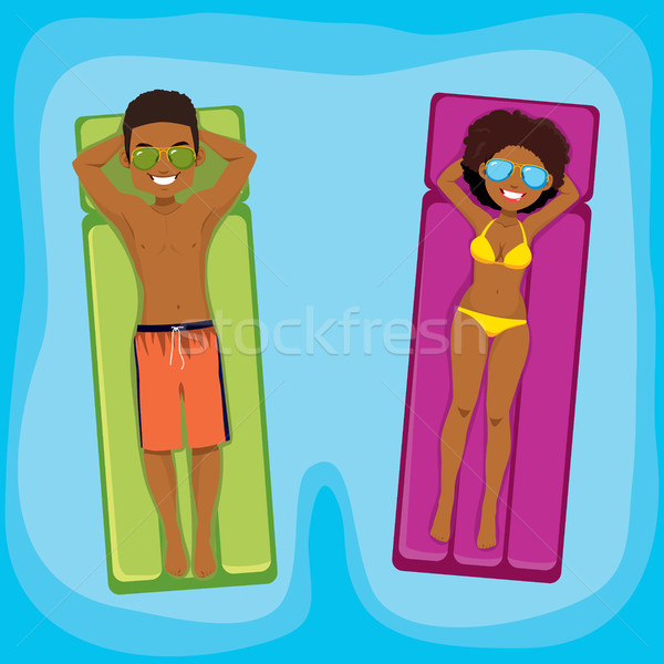 Couple gonflable piscine jeunes [[stock_photo]] © Kakigori