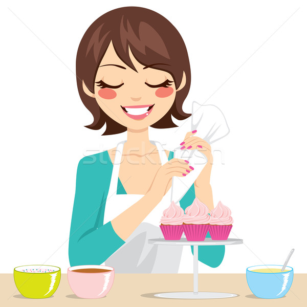 Woman Decorating Cupcakes Stock photo © Kakigori