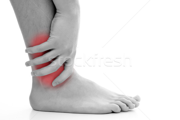 Tobillo dolor joven mano masaje músculo Foto stock © kalozzolak