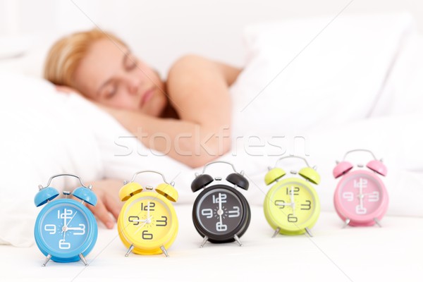 álmodik gyönyörű fiatal nő alszik ágy sok Stock fotó © kalozzolak