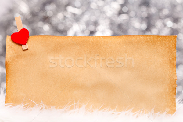 Little red heart clipped onto old paper Stock photo © kalozzolak