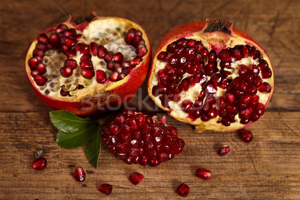 Grenadines with seeds on wooden table Stock photo © kalozzolak