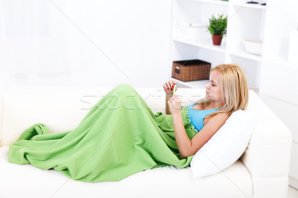 Girl with thermometer Stock photo © kalozzolak