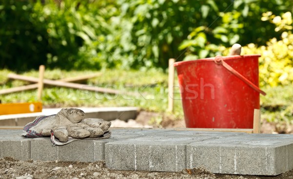 építkezés vödör kőművesmunka kesztyű ház fal Stock fotó © kalozzolak