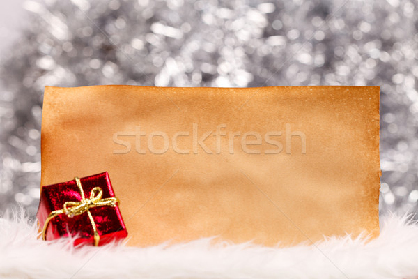 Gift and old sheet of paper Stock photo © kalozzolak