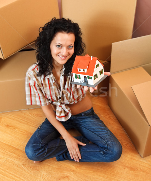 Woman with miniature house Stock photo © kalozzolak