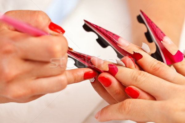 Kunstmatig nagel handen twee vrouwen een Stockfoto © kalozzolak