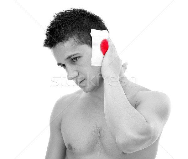 рана уха кровотечение молодым человеком изолированный белый Сток-фото © kalozzolak