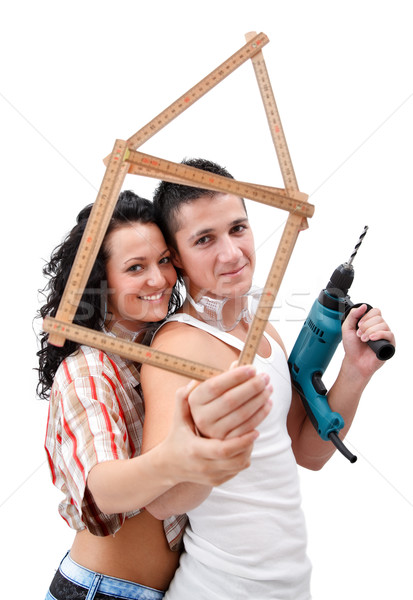 Couple with folding rule Stock photo © kalozzolak