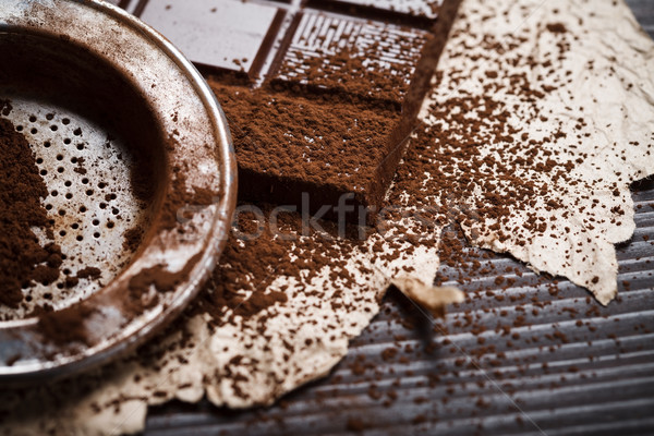 Silver sieve with cocoa dust on chocolate Stock photo © kalozzolak