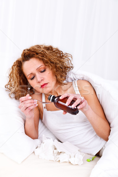 Mujer toma jarabe jóvenes mujer hermosa gripe Foto stock © kalozzolak