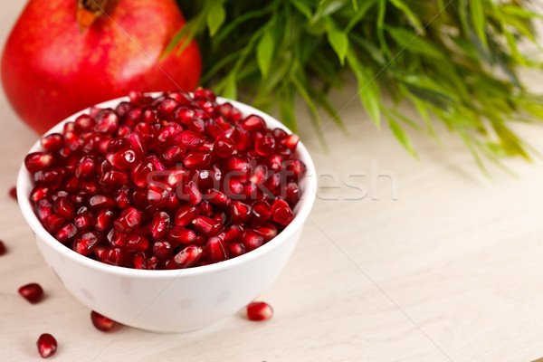 Grenadine seeds with fruit and leaves Stock photo © kalozzolak