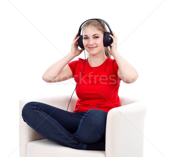 Menina fones de ouvido escuta música mulher diversão Foto stock © kalozzolak