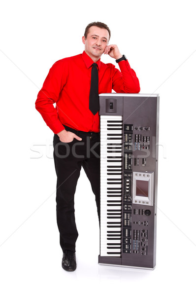 Posant instrument impressionnant jeune homme homme fond [[stock_photo]] © kalozzolak