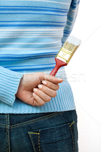 Brush in a womans hand Stock photo © kalozzolak