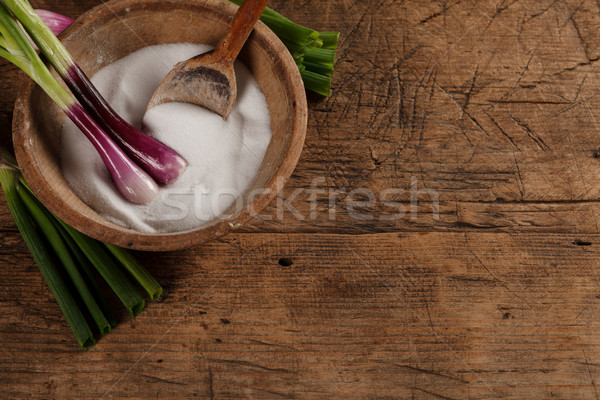 Old salt box with green onions Stock photo © kalozzolak