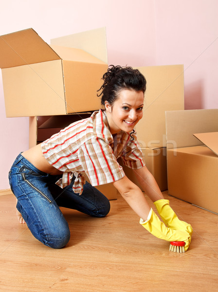 étage heureux jeune femme jaune gants en caoutchouc [[stock_photo]] © kalozzolak