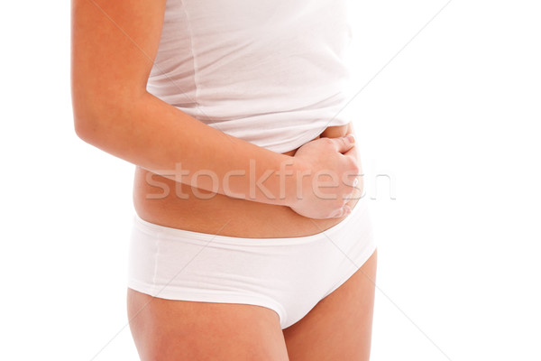 Dziewczyna ból brzucha biały strony młodych ból Zdjęcia stock © kalozzolak