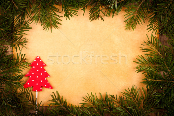 Little spotted Christmas tree with old paper and branch Stock photo © kalozzolak