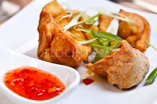 Indian appetizer - Crispy chicken wontons Stock photo © kalozzolak