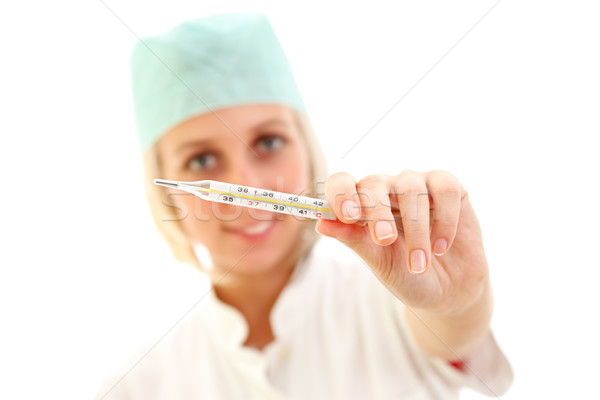 Nurse with clinical thermometer Stock photo © kalozzolak