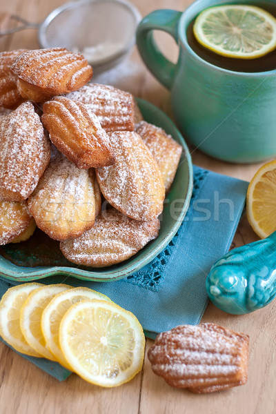 Madeleines with tea Stock photo © Karaidel