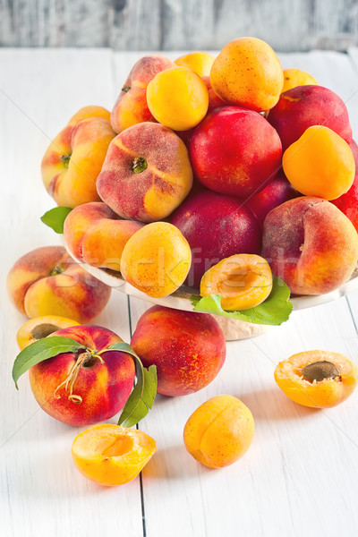 Apricots, nectarines and saturn peaches Stock photo © Karaidel