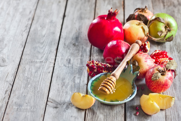Pomegranate, apples and honey background Stock photo © Karaidel